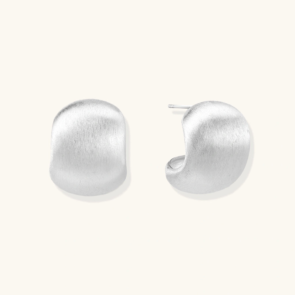 Brushed sterling silver cushion-shaped stud earrings with matte finish on white background