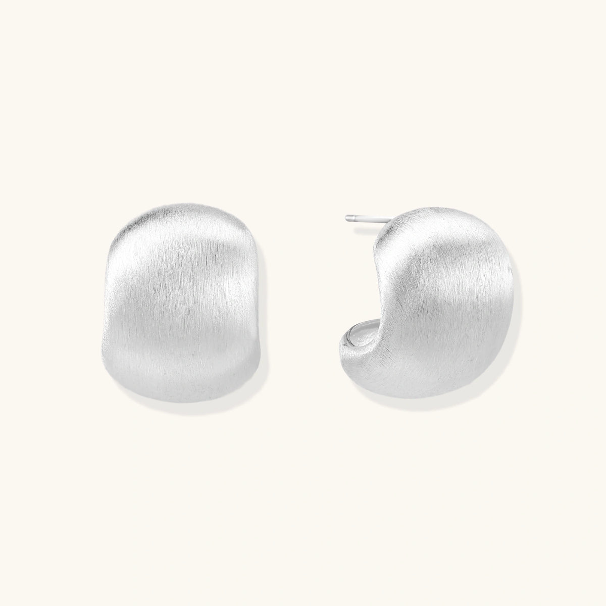 Brushed sterling silver cushion-shaped stud earrings with matte finish on white background